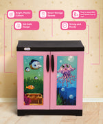 Load image into Gallery viewer, A children's two-door storage cabinet with a pink frame and black top/base, featuring ocean-themed printed doors with fish, a treasure chest, and a purple octopus. The cabinet is shown against a beige star-patterned wall with pink callout bubbles highlighting product features.